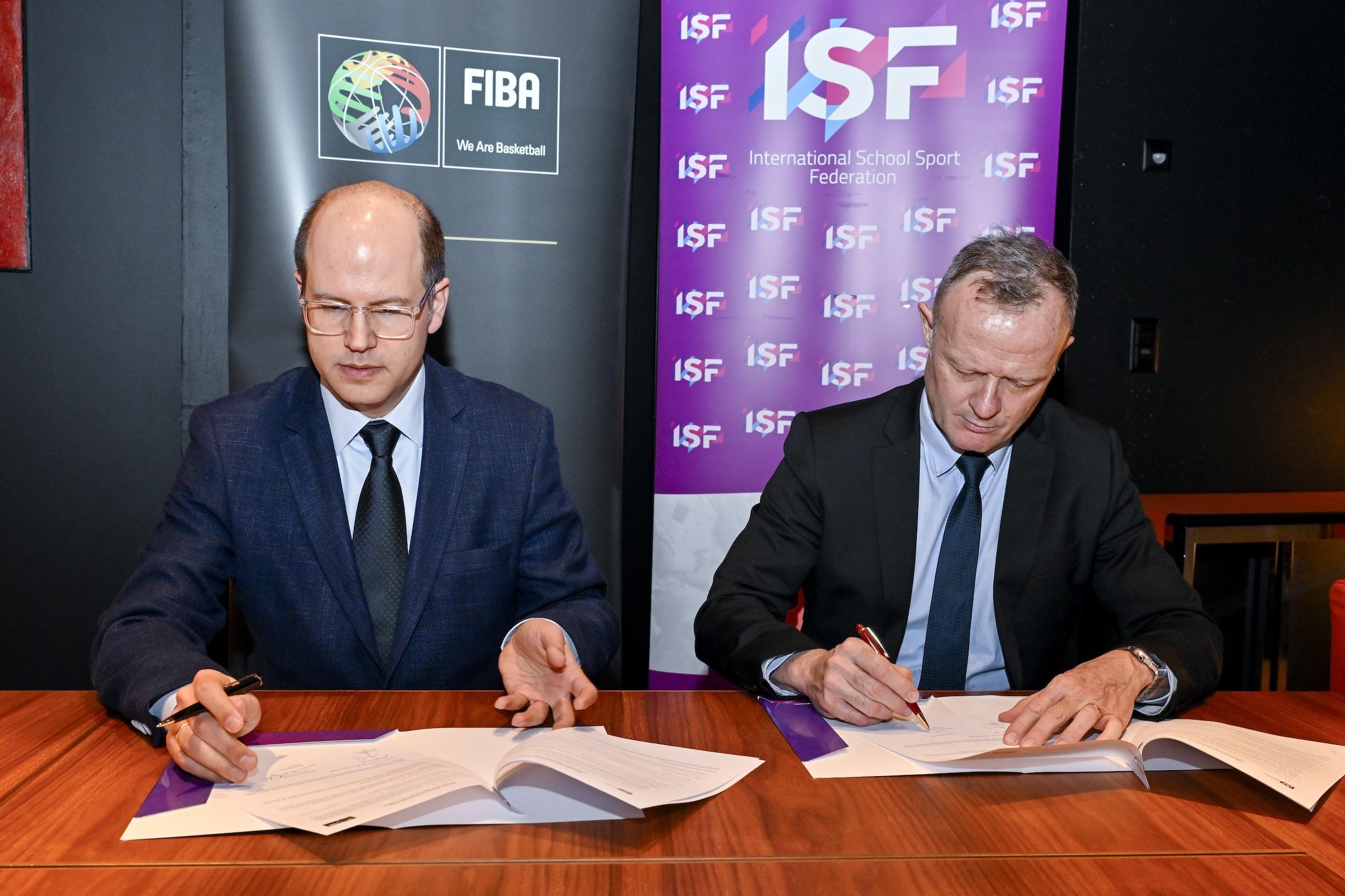 ISF President Laurent Petrynka and FIBA Secretary General Andreas Zagklis sign coorperation MOU